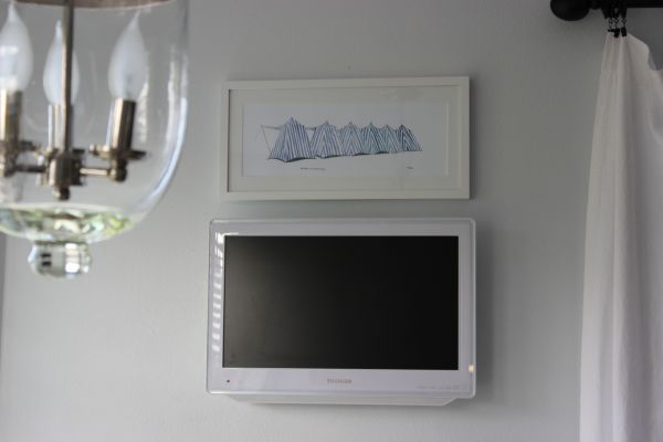 I finally got my light fixture re-ordered (the first came with a chip and faulty wire) and hubby hung it. I also framed and matted the painting of the blue striped cabana s I picked up during my last trip to Dinard, France. I finally got my light fixture re-ordered (the first came with a chip and faulty wire) and hubby hung it. I also framed and matted the painting of the blue striped cabana s I picked up during my last trip to Dinard, France.