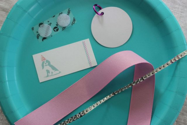 For a craft activity we made dog tags and collars for their adopted dog.  I placed the makings on a plate, but they would pick their collar color.   Each gal got a certificate to fill out-free printable download! (resources for link)